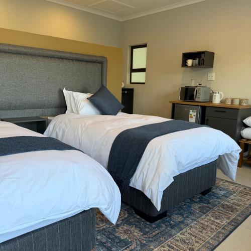 Postel nebo postele na pokoji v ubytování Cozy NooK Mariental