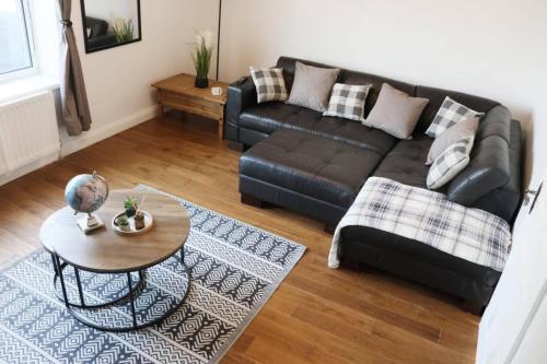 a living room with a couch and a table at The Coach House - 1 mile from Beamish Museum in Beamish