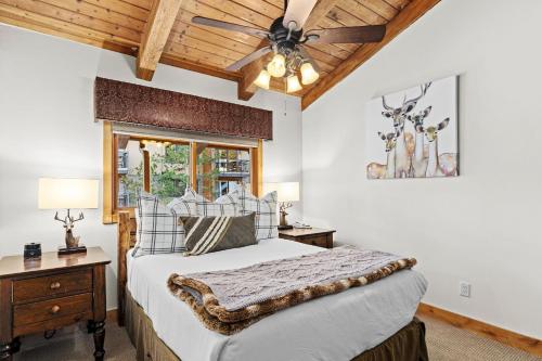 a bedroom with a bed and a ceiling fan at Crestwood 1307 Deluxe 1 Bedroom plus Loft in Snowmass Village