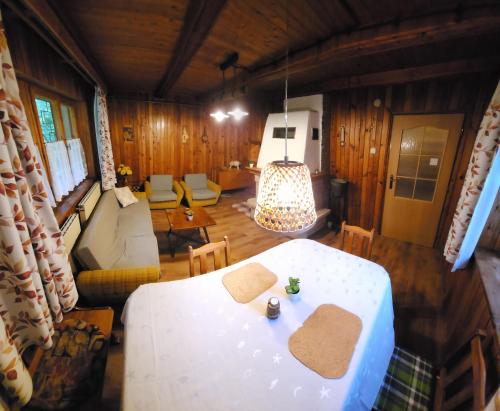 a room with a table and a living room at Chata u Hagrida in Štrba
