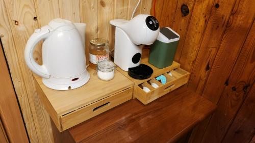 a white mixer sitting on a wooden shelf in a room at Chata u Hagrida in Štrba