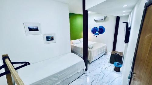 Krevet ili kreveti u jedinici u okviru objekta Pousada Praiana - Noronha