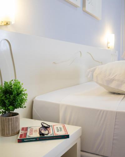 Postel nebo postele na pokoji v ubytování Hotel Caverá