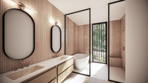 un baño con dos lavabos y dos espejos en Será at Sandy Ridge - Brand New Modern WV Retreat, en Wardensville