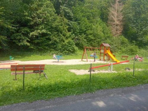 a park with children playing on a playground at Dvojizbový Útulný Apartmán Oščadnica in Oščadnica