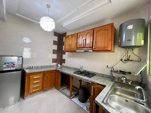 Kuchyň nebo kuchyňský kout v ubytování Prestige Apartment - Fes Elegant Stay