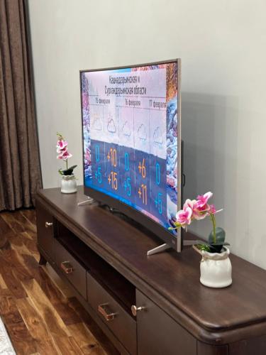 Телевизор и/или развлекательный центр в Garden - Apartment hotels
