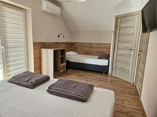 Ένα ή περισσότερα κρεβάτια σε δωμάτιο στο Villa Karta