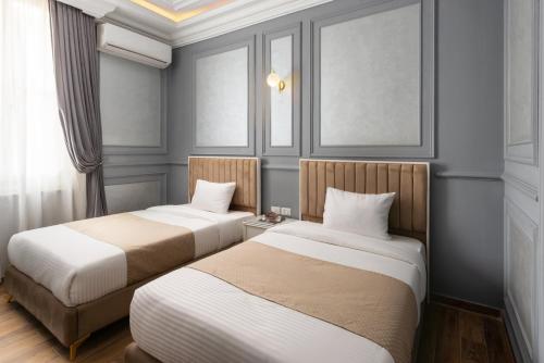 Postel nebo postele na pokoji v ubytování Sayed Effendi - Boutique Hotel