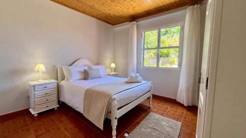 Postel nebo postele na pokoji v ubytování Domingos Reis