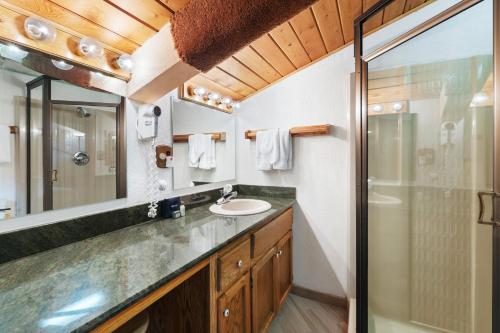 a bathroom with a sink and a mirror and a shower at Crestwood 3312 Standard 1 Bedroom Plus Loft in Snowmass Village
