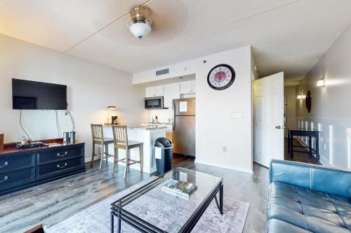 a living room with a couch and a table at Water Street Condos Unit 808 in Wilmington