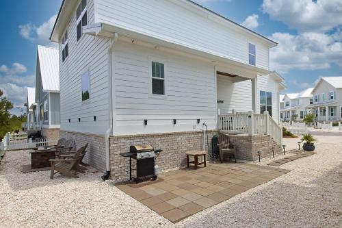 a white house with a fireplace in front of it at Endless Summer in Gulf Shores