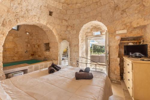 Ένα ή περισσότερα κρεβάτια σε δωμάτιο στο Villa Trullo Grecale