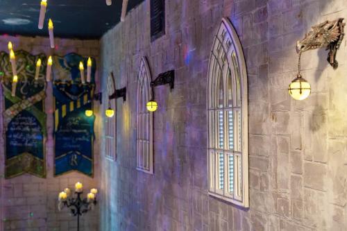 a brick wall with windows and lights on it at Stay at Hogwarts Harry Potter's Home, Free Parking, Pets Allowed in Kissimmee