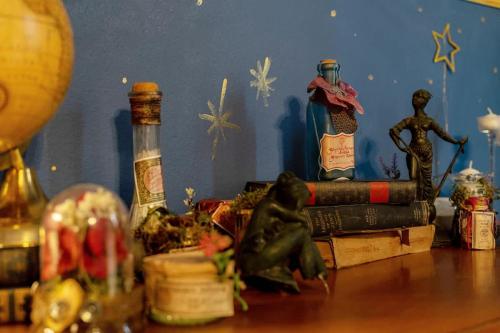 a table with books and figurines on top of it at Stay at Hogwarts Harry Potter's Home, Free Parking, Pets Allowed in Kissimmee