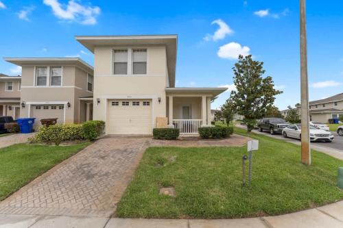 a large white house with a driveway at Stay at Hogwarts Harry Potter's Home, Free Parking, Pets Allowed in Kissimmee