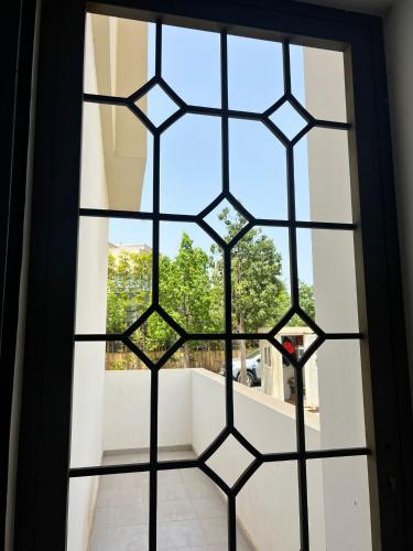 a window with a view of a balcony at Résidence Liyam in Casablanca