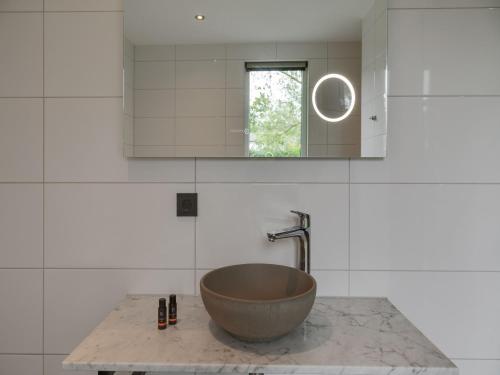 a bowl sink on a counter in a kitchen at Bungalow in Texel near National Park in Westermient