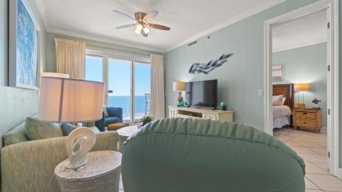 a living room with a couch and a ceiling fan at Island Royale P202 in Gulf Shores
