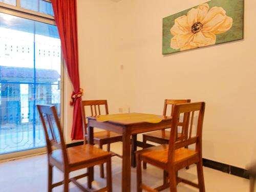 a dining room with a table and chairs and a window at Spacious Beachfront Condo -AC - WiFi, Uroa Escape Zanzibar in Uroa
