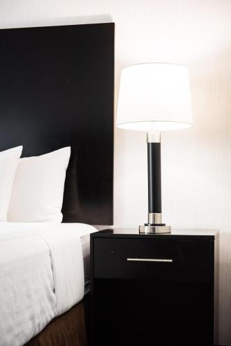 Ένα ή περισσότερα κρεβάτια σε δωμάτιο στο Garden Executive Hotel
