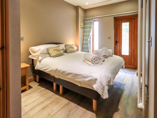 Voodi või voodid majutusasutuse Abbots Reading Cottage toas