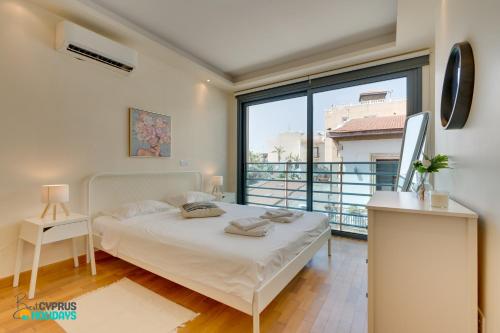 Ένα ή περισσότερα κρεβάτια σε δωμάτιο στο Dios Ponte 102 Beachfront