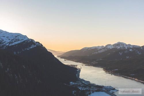 a view of a river between two mountains at Juneau Hideaway-Glaciers-5 min to downtown- Hiking in Juneau