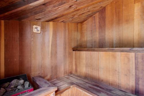 an empty wooden sauna with wooden walls and wood floors at Headlands View Home in Mendocino