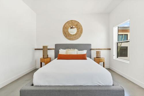 a bedroom with a bed and a window at Desert Contemporary Compound - Large Modern Oasis in Joshua Tree
