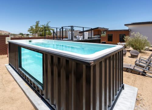 a swimming pool on top of a house at Desert Contemporary Compound - Large Modern Oasis in Joshua Tree