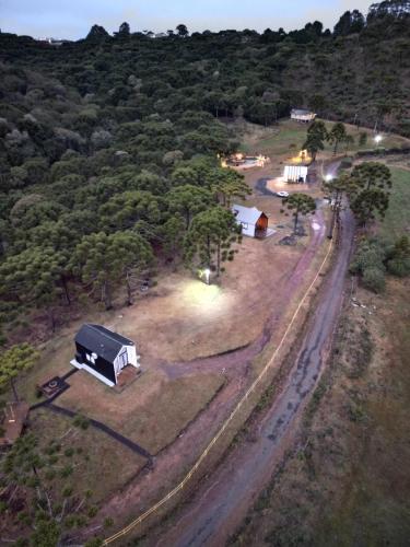 an aerial view of a farm with a truck at Morada Reino Encantado in São Joaquim