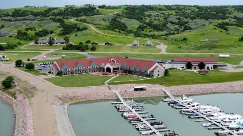 an aerial view of a large house with a marina at Cedar Shore Resort in Oacoma