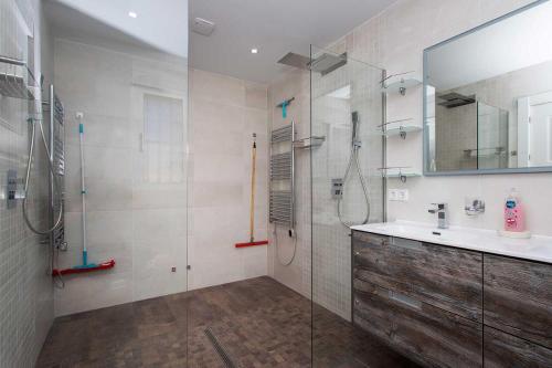 a bathroom with a glass shower and a sink at CH Villa Jupiter La Marquesa in Rojales