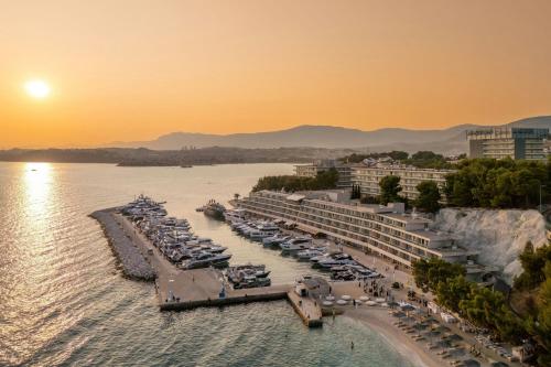 a group of boats docked at a marina at sunset at Le Meridien Lav Split in Podstrana
