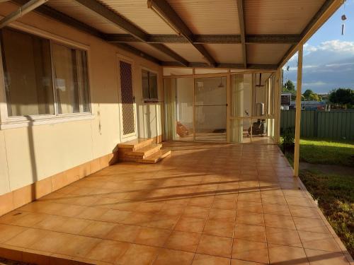 an outdoor patio with awning on a house at Fossicker Caravan Park in Glen Innes