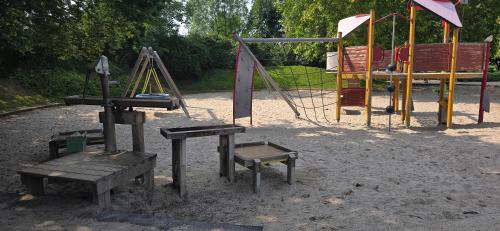 a park with a swing set and a playground at Central apartment in LINZ in Linz