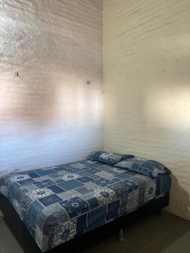 Katil atau katil-katil dalam bilik di Casa com piscina próxima a praia de Águas Belas