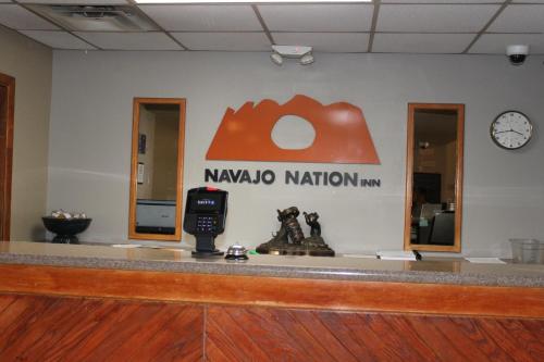 a waiting room with a naya naya nation sign on the wall at Navajo Nation Inn in Window Rock