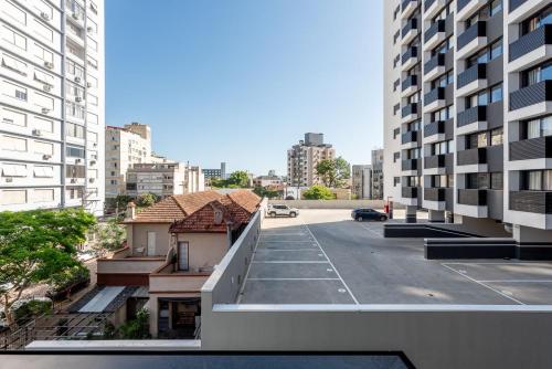an empty street in a city with tall buildings at GO Rio Branco by LikeHome in Porto Alegre