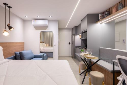 a living room with a kitchen and a dining room at GO Rio Branco by LikeHome in Porto Alegre