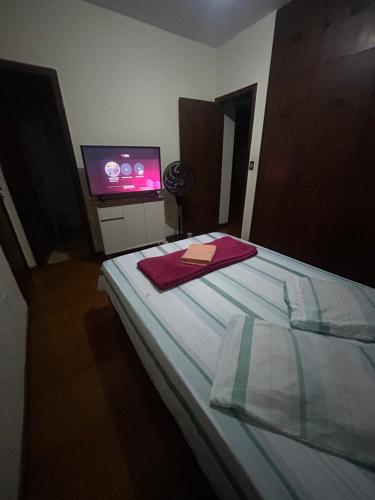 Letto o letti in una camera di Casa 5 quartos entre Centro e Pampulha