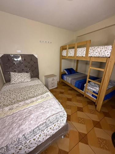 a bedroom with two bunk beds at Blue House in Lima