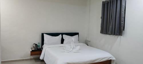 Postel nebo postele na pokoji v ubytování The Pearl Inn