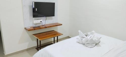 Postel nebo postele na pokoji v ubytování The Pearl Inn