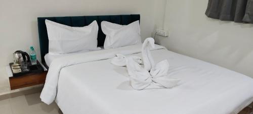 Postel nebo postele na pokoji v ubytování The Pearl Inn