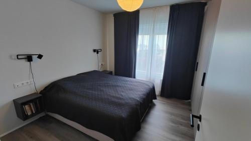 Tempat tidur dalam kamar di Rivertown