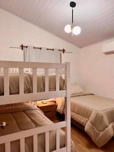 Ένα ή περισσότερα κρεβάτια σε δωμάτιο στο Secreto La Paloma Cabaña Boutique con Jacuzzi y Domo