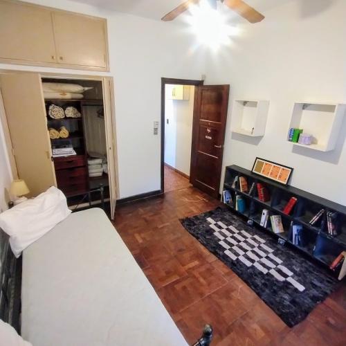 a bedroom with a bed and a room with a closet at Bella y cómoda in Santa Rosa